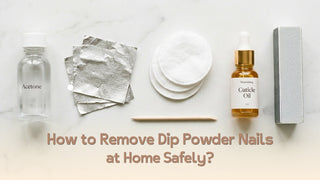 Tools needed to remove dip powder nails at home — acetone, foil, cotton pads, and cuticle oil on marble surface Caption: none