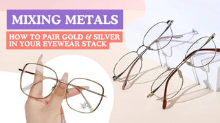 A hand holds thin square frames beside oval gold and silver glasses.