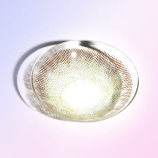 Macro shot of a grey contact lens color, showing the dotted pattern designed to transition seamlessly onto an iris, on a light background