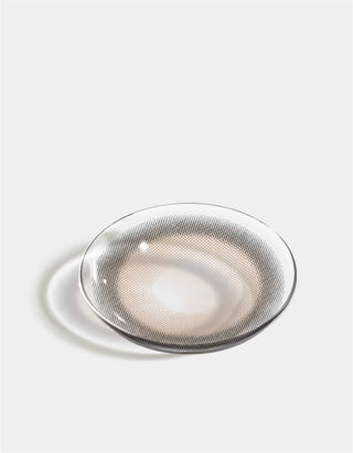 a flatlay photograph of the contact lens eyesm hugmoon muse brown in a white background montage showing the detail of the contact lens