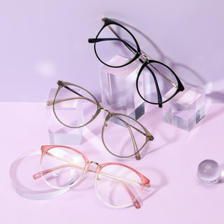 Various colors of the Infinity oversized eyeglass frames, in pink, brown and black, available in blue light blocking lenses and readers, photographed on a purple background, from EyeCandys