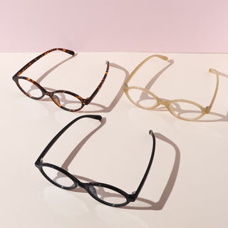 Eyecandys Cassian Unisex Oval Full Frame Glasses in Tortoiseshell, Black, and Beige, made from high-quality TR material for a lightweight, comfortable fit. Ideal for those seeking both durability and style