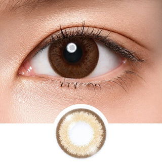 Close-up shot of model's eye adorned with Acuvue Vivid Sheer Allure color contact lens dailies, complemented by clean eye makeup, showing the brightening effect of the circle lenses on dark brown eyes, above a cutout of the colour contact lens design with radial spiked pattern