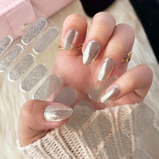 Hand with EyeCandys All That Glitters Gel nail stickers applied, showcasing a dazzling glittery design. Ideal for glamorous, long-lasting manicures, offering easy application, vibrant color, and a salon-quality gel finish for flawless nails