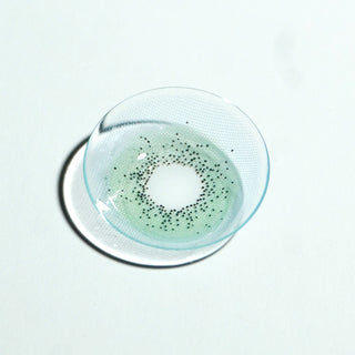 Macro shot of EyeCandys Pink Label Amalfi Blue colored contact lenses – vivid blue prescription color contact lenses for a striking, eye-enhancing look.