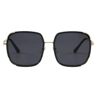 Amalfi Black Gold sunglasses from EyeCandys, showcasing a chic summer look with purple tinted lenses and a sleek frame