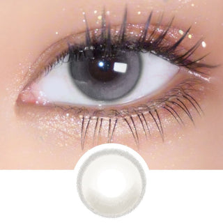 Macro shot of EyeCandys Amelie Earl Grey lens on eye with long lashes, with detailed lens design displayed underneath.