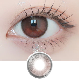 Close-up shot of model's eye adorned with Ann365 Anreen Brown Choco daily color contact lenses with prescription, paired with clean-girl eye makeup, showing the brightening and enlarging effect of the circle contact lens on dark brown eyes, above a cutout of the contact lens with limbal ring on a white background.