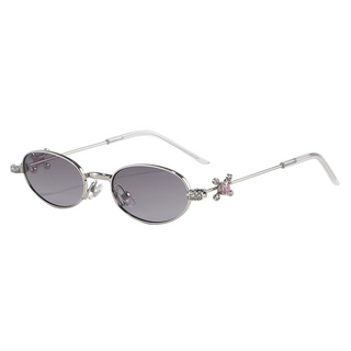 Eyecandys Auden sunglasses in Silvery Dark Grey with sleek oval lenses, crystal temple accents, and slim metal frame – a stylish option for UV protection, polarized lenses, or prescription wear.
