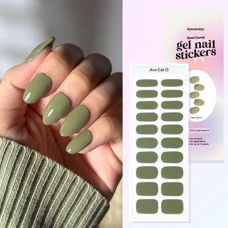 Hand with EyeCandys Avo-Cat-O Gel Nail Sticker – soft avocado green semi-cured gel manicure, easy 10-minute salon-quality application, lasts 2–3 weeks, 7-free allergy-friendly formula, UV/LED light required, fresh and trendy spring nail design.