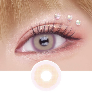 Pink Label Mykonos Pink color contact lens on top of a dark eye paired with peach shimmering eye makeup and curled wispy eyelashes, above the contact lens design.