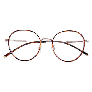 A pair of EyeCandys Banger Round glasses with thin, tortoiseshell-patterned frames embodying the dark academia trend. These minimalist and retro-styled eyeglasses feature clear nose pads and metallic temples with brown tips for a classic look.
