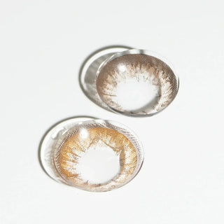 EyeCandys Pink Label Grang Choco and Grang Big Brown prescription contact lenses provide rich, natural hues for a bold yet realistic eye enhancement. The Grang Choco offers a warm chocolate brown tone, while the Grang Big Brown enhances eyes with a larger, striking brown effect. Both lenses are designed for comfort and style, available in various prescriptions, and perfect for daily wear, giving a captivating, eye-catching look with enhanced size and color.