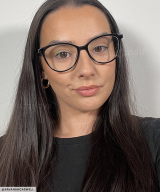 Model wearing the Billionnaire black oval glasses from EyeCandys
