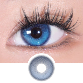 Close-up of dark brown eye wearing Eyecandys Bunnie Jelly Blue prescription colored contact lens with lens design displayed underneath. Full fluffy eyelashes with natural lash extensions frame the look