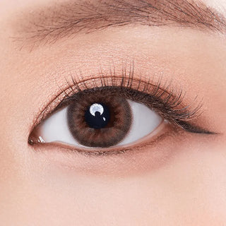 Macro shot of an eye wearing the Olola Dazzling 1-Day Rosie Hazel (10pk) (KR) prescription colour contact lens, showing the multi-colored detail and natural effect on dark brown eyes.