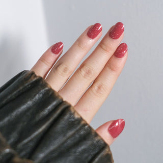 An image of a hand model showcasing the Candy Cane Nail Gel Sticker.