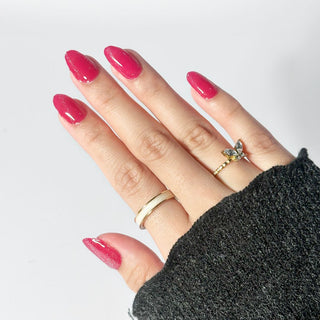 An image of a hand model showcasing the Candy Cane Nail Gel Sticker.