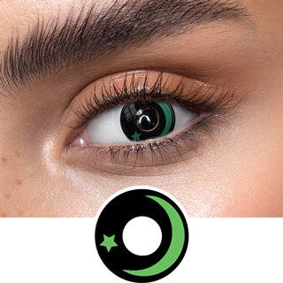 Green star colored contact lenses on an dark eye, showing the opacity and vividness of the Halloween contact lens, above a cutout of the green contact lens pattern