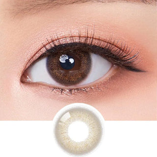 Macro shot of an eye wearing the Olola Dewie Brown (KR) colour contact lens, showing the multi-colored detail and natural effect on dark brown eyes, with clean eye makeup