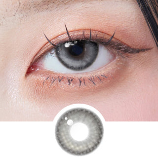 Close-up shot of model's eye adorned with Dollring Jamie Grey prescription colored contacts, complemented by clean eye makeup, showing the brightening effect of the prescription cosmetic contact lens on dark brown eyes.