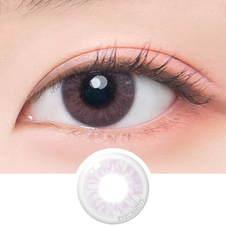 Close-up of model's eye featuring Bono Pink color contact lens, complemented by peach eyeshadow, with a cut-out of the same lens below