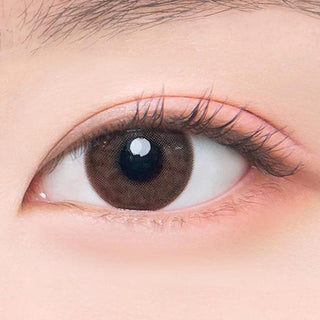 Macro shot of an eye wearing the DooNoon Epic 1-Day Grey (10pk) prescription colour contact lens, showing the multi-colored detail and natural effect on dark brown eyes.