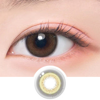 Macro shot of an eye wearing the DooNoon Jinju 1-Day Brown (10pk) prescription colour contact lens, showing the multi-colored detail and natural effect on dark brown eyes, with clean eye makeup. At the bottom is the pattern of the colored lens design, showing the dotted detail and pigmentation.