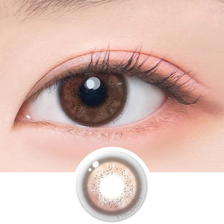 Macro shot of an eye wearing the DooNoon Jinju Shell 1-Day Brown (10pk) prescription colour contact lens, showing the multi-colored detail and natural effect on dark brown eyes, with clean eye makeup. At the bottom is the pattern of the colored lens design, showing the dotted detail and pigmentation.