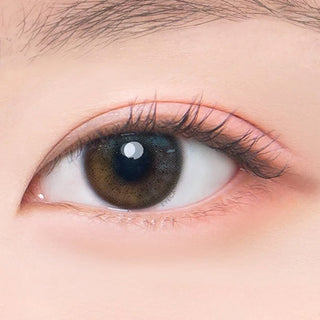 Macro shot of an eye wearing the DooNoon Jinju Shell 1-Day Grey (10pk) prescription colour contact lens, showing the multi-colored detail and natural effect on dark brown eyes.
