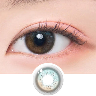 Macro shot of an eye wearing the DooNoon Jinju Shell 1-Day Grey (10pk) prescription colour contact lens, showing the multi-colored detail and natural effect on dark brown eyes, with clean eye makeup. At the bottom is the pattern of the colored lens design, showing the dotted detail and pigmentation.