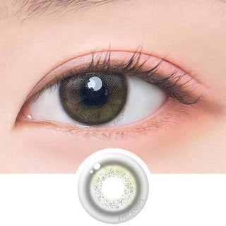 Macro shot of an eye wearing the DooNoon Jinju Shell 1-Day Olive (10pk) prescription colour contact lens, showing the multi-colored detail and natural effect on dark brown eyes, with clean eye makeup. At the bottom is the pattern of the colored lens design, showing the dotted detail and pigmentation.