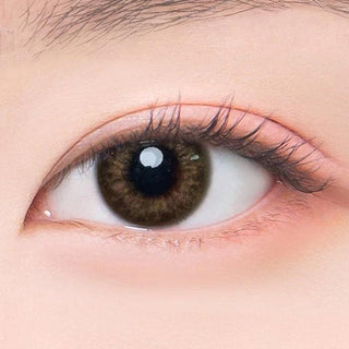 Macro shot of an eye wearing the DooNoon Rona 1-Day Brown (10pk) prescription colour contact lens, showing the multi-colored detail and natural effect on dark brown eyes.