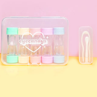 5 Colorful Contact Lens Cases placed inside a plastic storage case with contact lens applicator and tweezers next to it