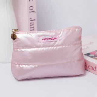 Soft pink EyeCandys cosmetic bag with zipper for organizing fragile items.