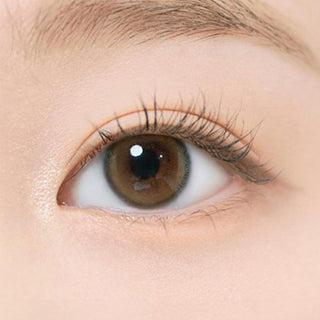 Close-up view of the i-DOL Eyeis Melo Brown coloured contact lenses on a woman's eye
