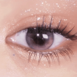 Close-up of an eye opening and closing while wearing EyeCandys Sakura Jelly Gel Nail Stickers. These stylish and easy-to-apply gel stickers add a vibrant sakura-inspired design to nails, perfect for those looking for trendy nail accessories with a delicate, floral touch