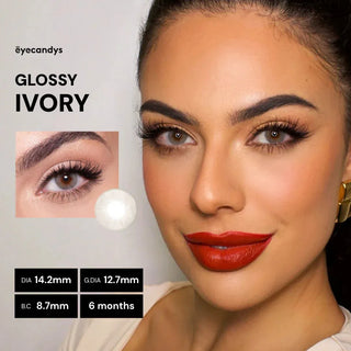 Advertisement for 'Glossy Ivory' eyelashes with a model wearing red lipstick, brand name 'eyecandys' displayed.