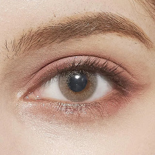 Close-up of eye wearing EyeCandys Attitude Glitter Grey contact lens – subtle glitter effect with natural grey color