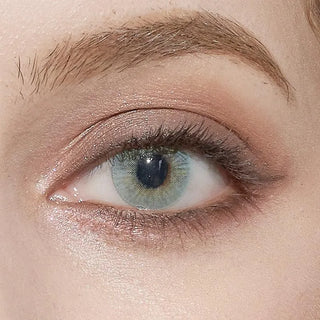 Close-up of Pink Label Dewy Aqua blue colored contact lens