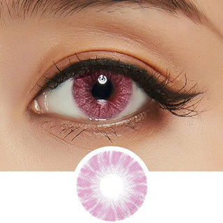 Macro shot of pink contact lens with intricate spokes design, modelled on a dark brown eye with natural eye makeup