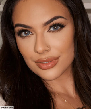 Model wearing Glossy Blue colour contacts with prescription with long lashes and neutral makeup