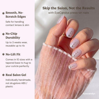 A hand with pastel pink, star-decorated reusable Gemini Press-On Nails by EyeCandys holds sheer fabric; text highlights smooth edges, no-chip durability, secure fit, and salon-quality gel finish.