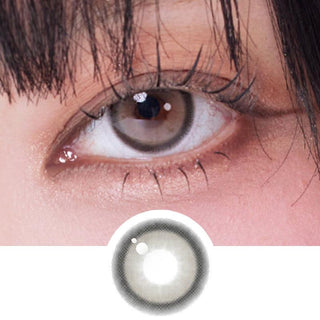 Close-up shot of a model wearing eyesm hugmoon muse grey prescription colored contact lens in one eye, on top of the contact lens pattern design.