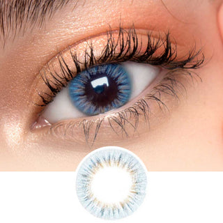 Close-up shot of model's eye adorned with EyeCandys I-Girl Blue daily color contact lenses with prescription, complemented by clean eye makeup, showing the brightening and enlarging effect of the circle contact lens on dark brown eyes, above a cutout of the contact lens pattern with limbal ring on a white background.