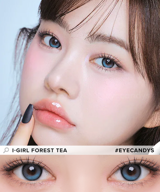 A female model with natural dark eyes wearing i-Girl One Pick Forest Tea contact lenses, complemented by subtle eyeshadow and peach lip gloss and Close-up image showcases the model's eyes adorned with the same blue-ish green contact lenses