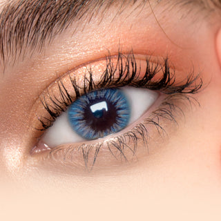 Close-up shot of model's eye adorned with I-Girl Blue color contact lenses with prescription, complemented by minimalist eye makeup, showing the brightening and enlarging effect of the circle contact lens on dark brown eyes.