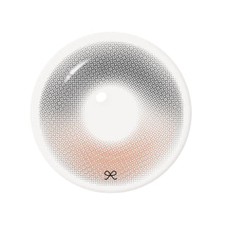 Close-up product image of brown-reddish gray contact lens featuring an intricate dotted pattern, soft gradient, hading, a clear central pupil opening, and a subtle brand logo.