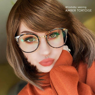 model with simple everyday make up look wearing Infinity Oversized Oval in tortoise