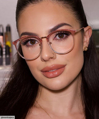 model with simple everyday make up look wearing Infinity Oversized Oval in rose crystal color